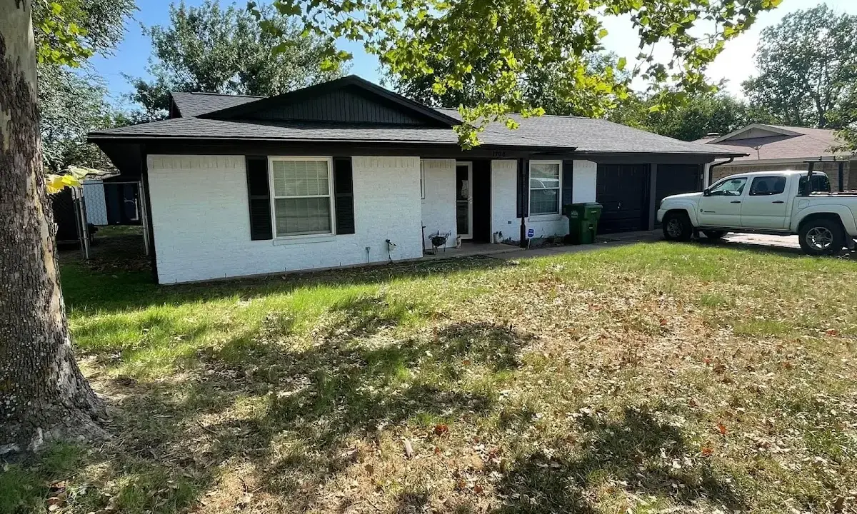 Professional roofing crew working on a residential roof in Terrace Heights